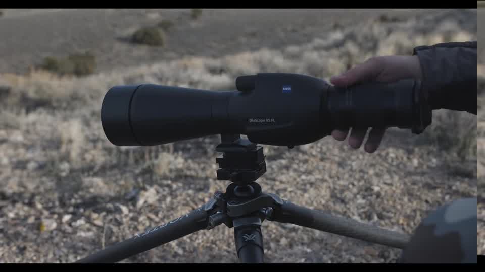 A spotting scope seating onto a MagRac base on a tripod in the Nevada high desert